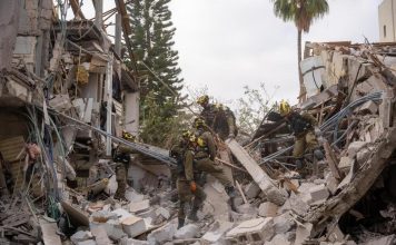 Home Front Command teams dispatched to missile impact site in Haifa. (IDF)