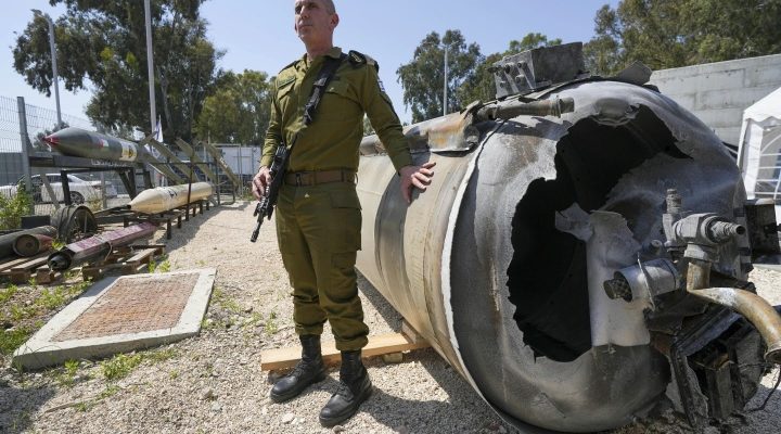 IDF spokesperson Danie Hagari displays to the media one of the Iranian ballistic missiles Israel intercepted over the weekend, at an army base in southern Israel, Tuesday, April 16, 2024. (AP/Tsafrir Abayov)