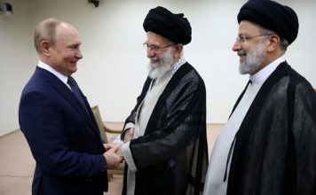 Supreme Leader Ayatollah Ali Khamenei, center, and Russian President Vladimir Putin, left, greet each other as Iranian President Ebrahim Raisi stands at right, during their meeting in Tehran, Iran, July 19, 2022. (Office of the Iranian Supreme Leader via AP)