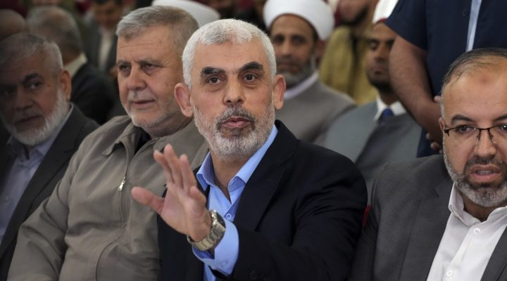 FILE - Yahya Sinwar, head of Hamas in Gaza, greets his supporters upon his arrival at a meeting in a hall on the sea side of Gaza City, on April 30, 2022.  (AP Photo/Adel Hana, File)