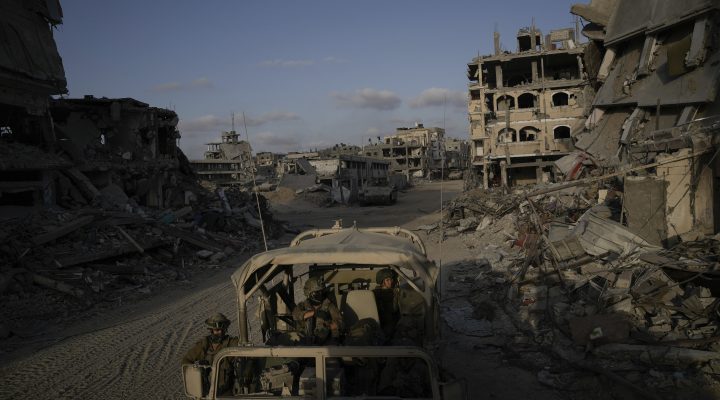 Israeli soldiers move next to destroyed buildings following Israeli strikes during a ground operation in the Gaza Strip on Friday, Sept. 13, 2024. (AP Photo/Leo Correa)