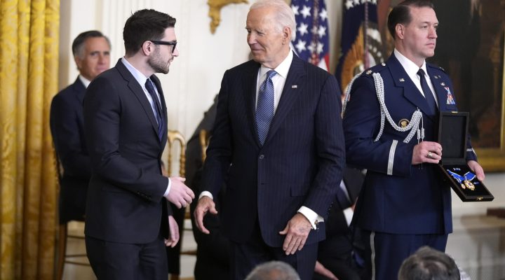 President Joe Biden, center, presents the Presidential Medal of Freedom, the Nation's highest civilian honor, to Alex Soros, left, on behalf of his father George Soros, in the East Room of the White House, Saturday, Jan. 4, 2025, in Washington. (AP Photo/Manuel Balce Ceneta)