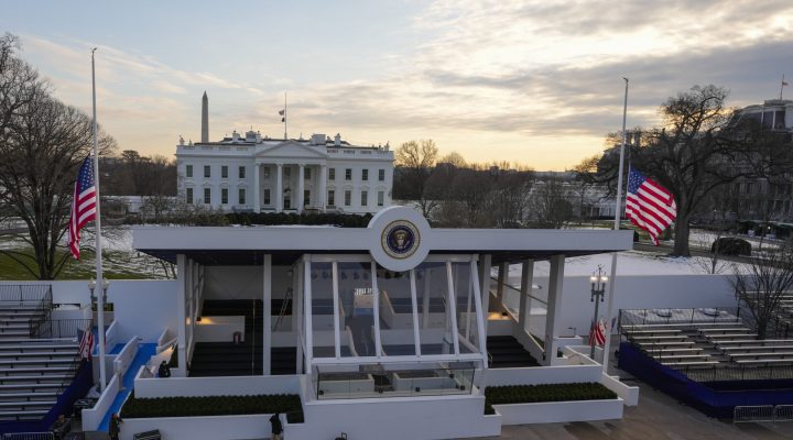 Workers continue with the finishing touches on the presidential reviewing stand on Pennsylvania outside the White House Thursday, Jan. 16, 2025, in Washington, ahead of President-elect Donald Trump's inauguration. (Jon Elswick via AP)