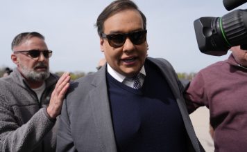 Former U.S. Rep. George Santos arrives at federal court for sentencing, Friday, April 25, 2025, in Central Islip, N.Y. (AP Photo/Julia Demaree Nikhinson)