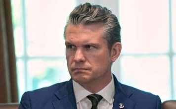 US Secretary of Defense Pete Hegseth listens during a cabinet meeting at the White House, April 30, 2025, in Washington. (AP Photo/Evan Vucci)