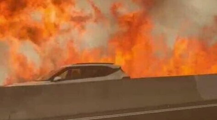 A fire rages on the Jerusalem-Tel Aviv highway on Wednesday, April 30.