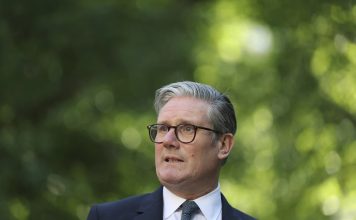 Britain’s Prime Minister Keir Starmer speaks during a reception following the UK-EU summit, in London, Monday May 19, 2025. (Hannah McKay/Pool via AP)